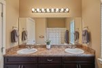 Master bathroom features double sinks for guests` convenience